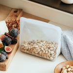 clear: stand-up holding pistachios