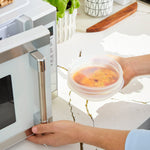 all: stretch lid covering bowl of soup