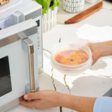 all: stretch lid covering bowl of soup