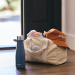 all: stasher water bottle infront of a gym bag