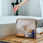 taupe: beauty weekender bag holding soaps