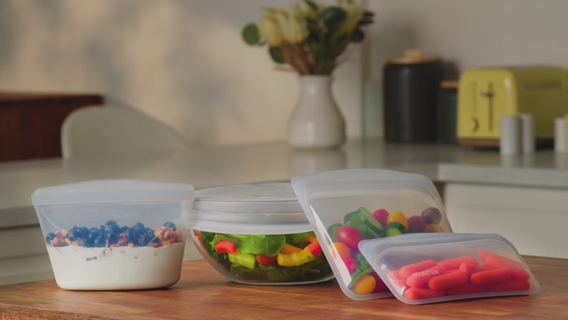video showing key stasher benefits and features. A family showing how they use Stasher bags and bowls and stretch lids in their daily life.