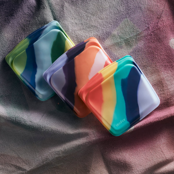 Three colorful reusable silicone sandwich bags for Earth Month
