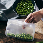 clear: snack bag holding peas