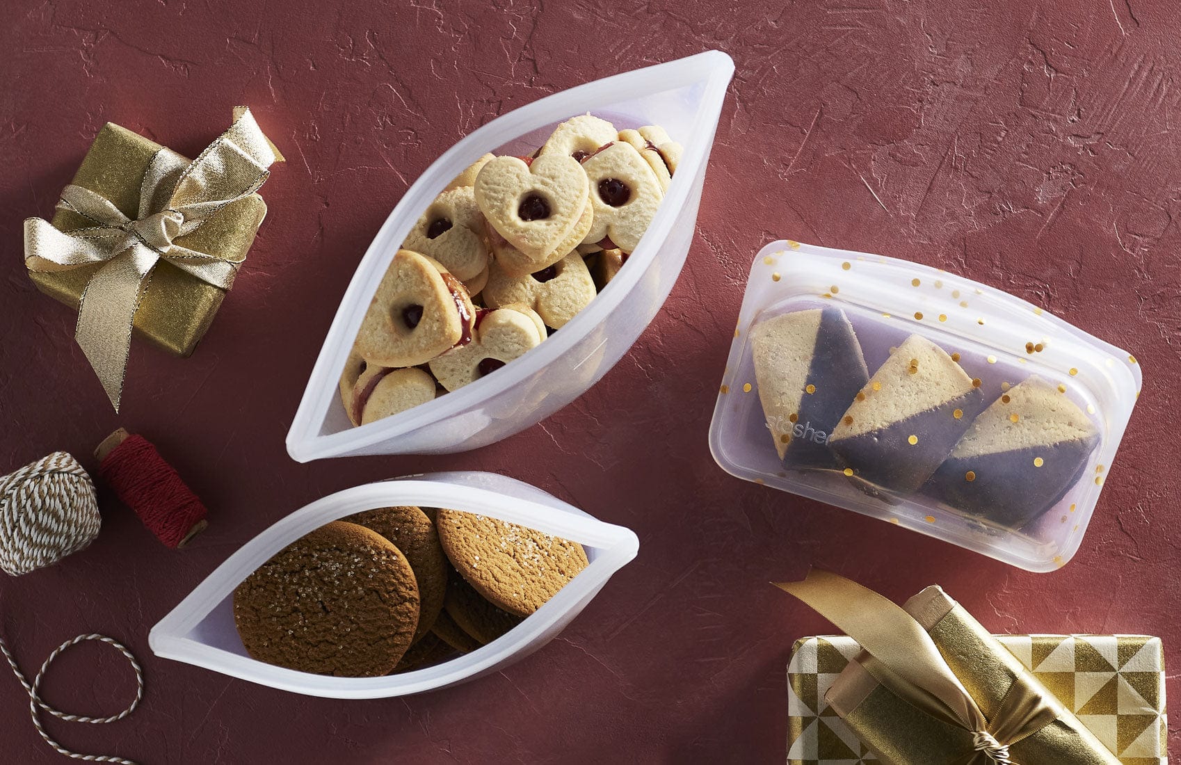 Black friday is here, save up to 40% off. Picture shows Stasher bags and bowls holding cookies. 
