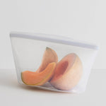 all: 8-cup clear bowl holding cantaloupe. 