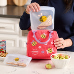 Bee: sandwich bag being placed in a bee printed lunch bag.