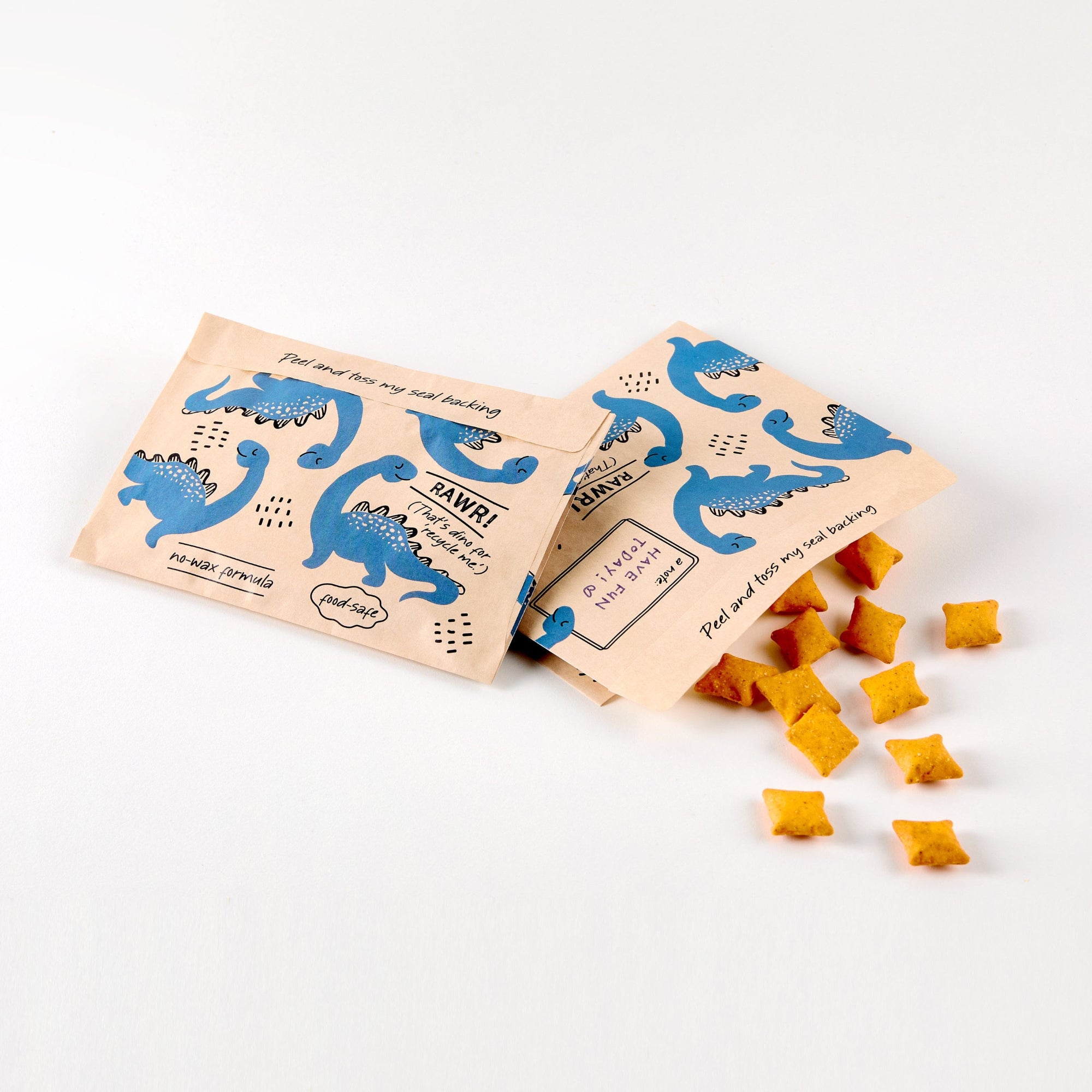 dinosaur: paper snack bags holding cheese snacks. 