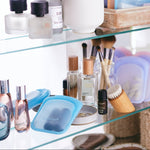 all: pocket bags holding vitamins and lipgloss