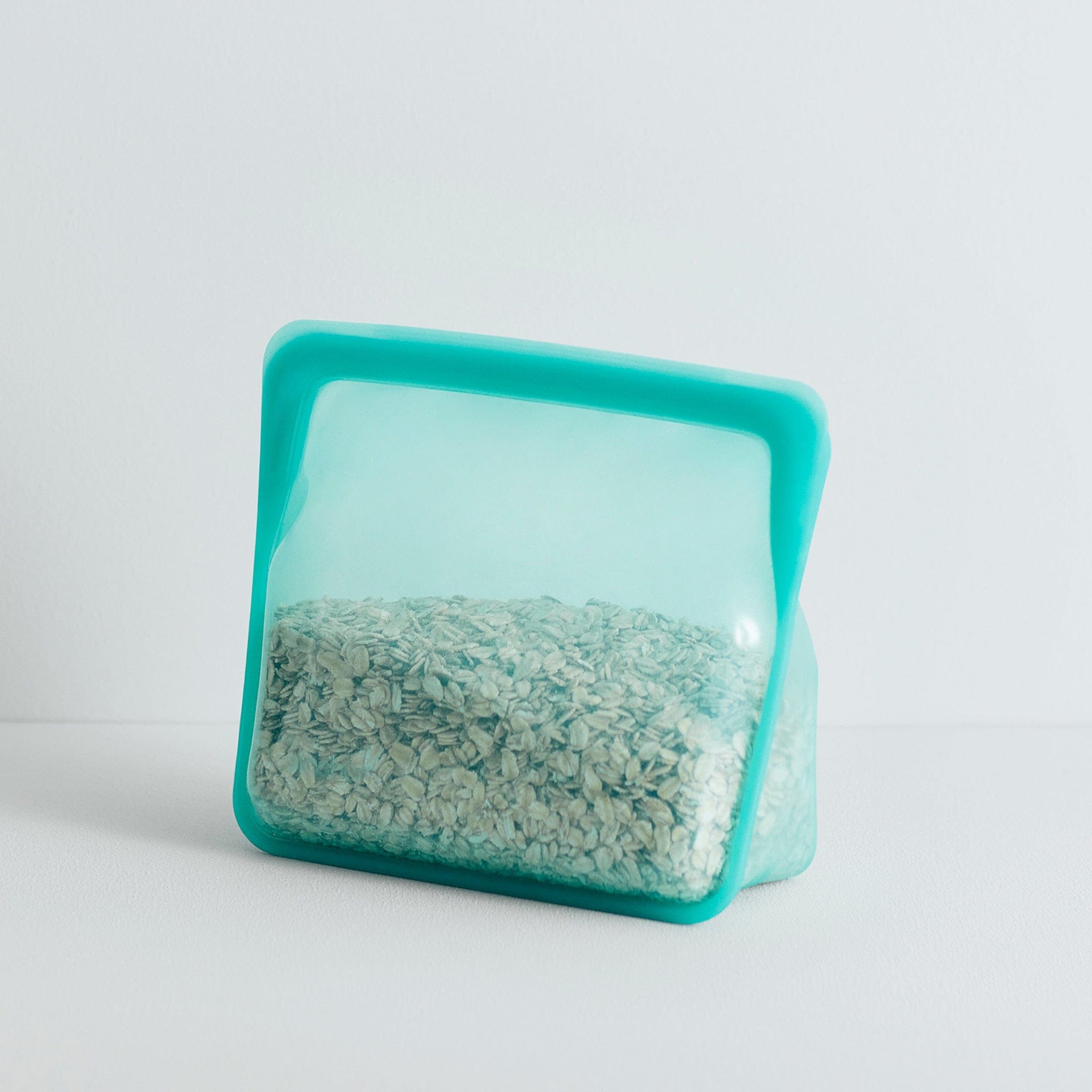 aqua: stand-up mid holding oats.