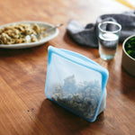 all: stand-up mid blue bag holding cauliflower