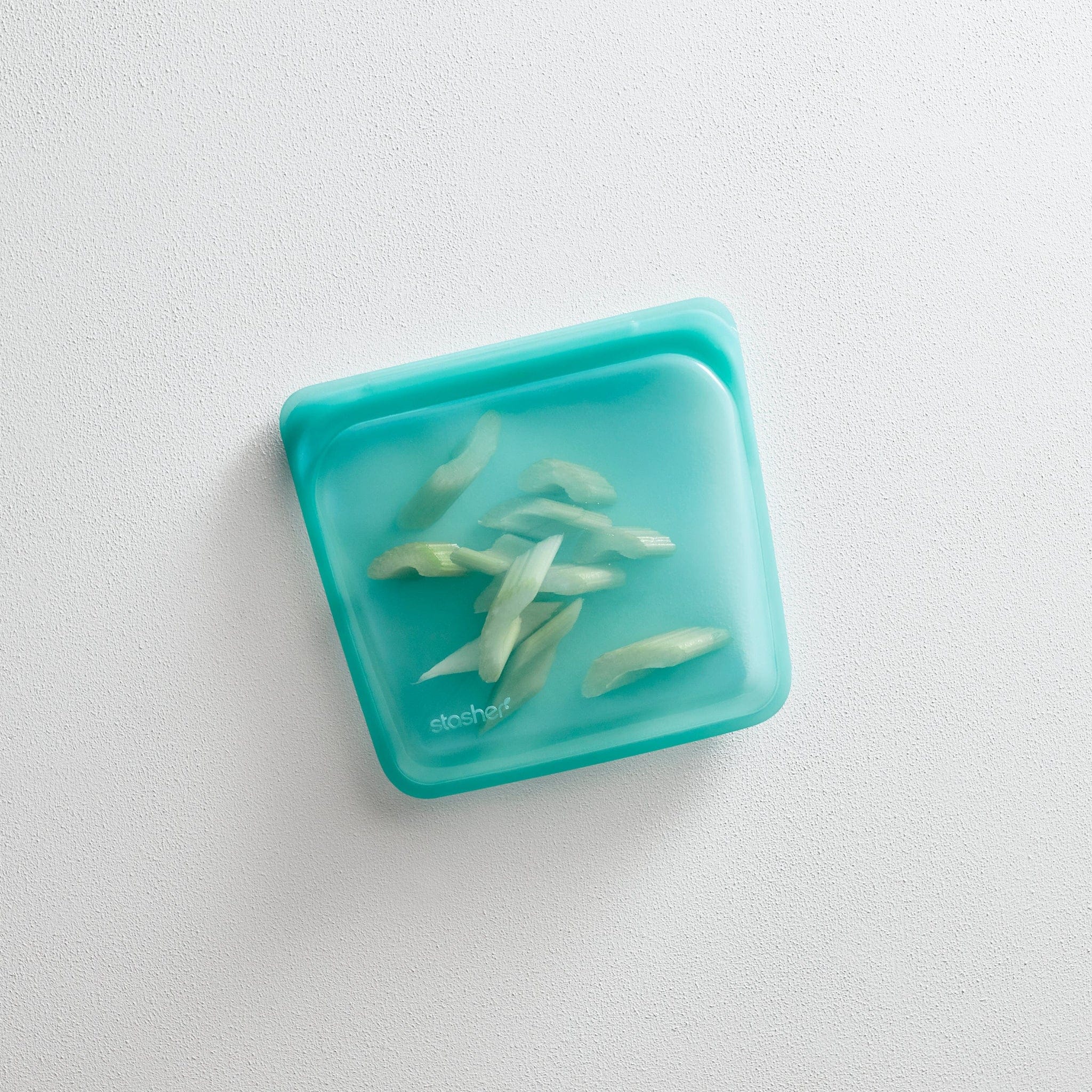 aqua: aqua sandwich bag hero image holding sliced celery