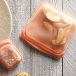 coral: stasher sandwich bag containing apples