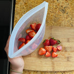 clear: bowl holding strawberries