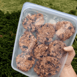 all: clear half gallon holding baked cookies. 