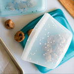 all: Silicone food storage containers with cookie dough.