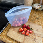 clear: bowl 4-cup holding strawberries