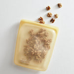 yellow: half gallon bag holding walnuts