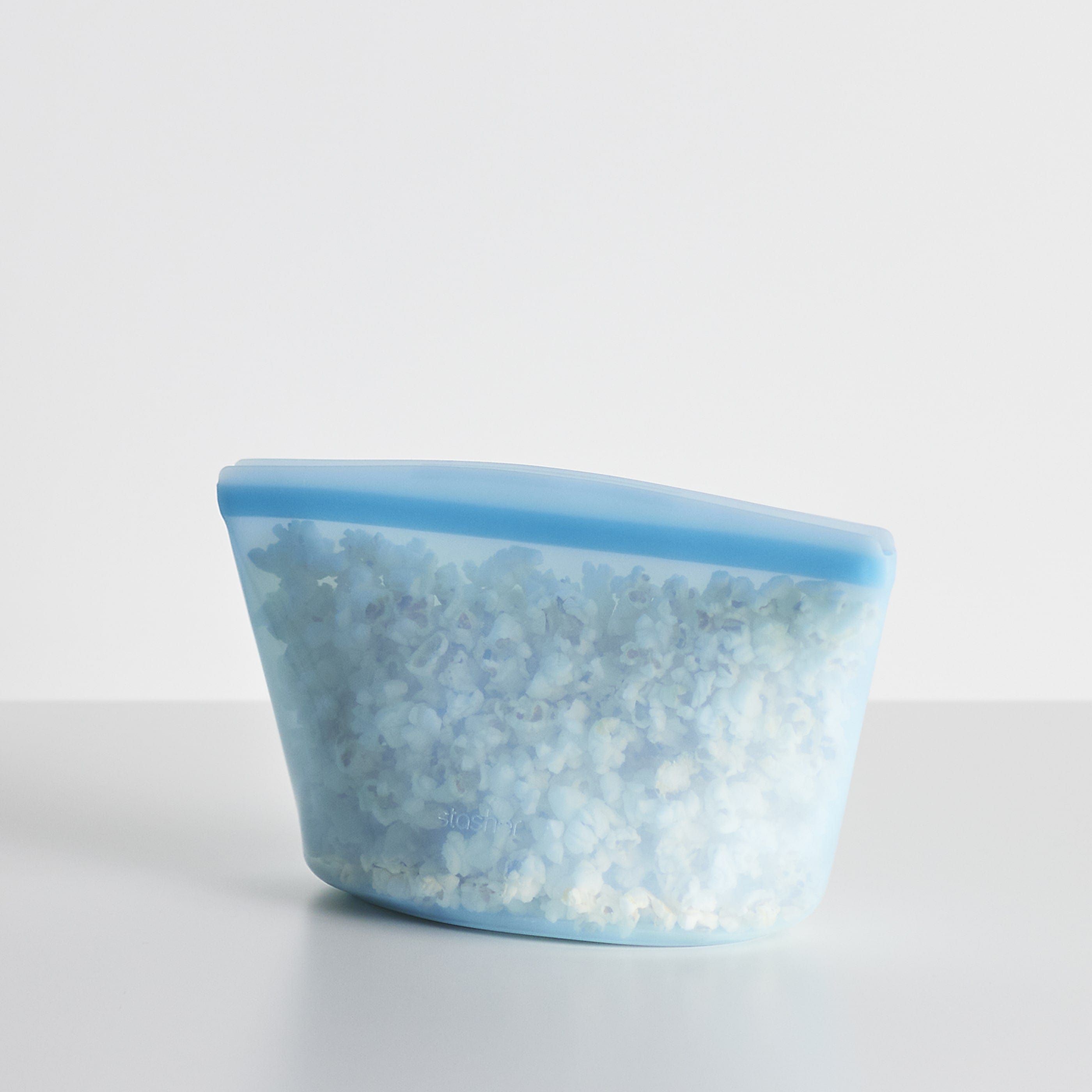 blue: blue 8 cup filled with popcorn