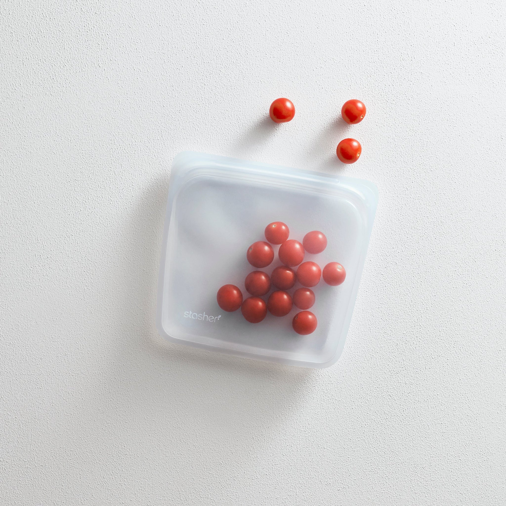 clear: sandwich bag holding cherry tomatoes